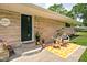 Charming front entrance featuring a seating area and green door at 6464 Whitley Ln, Indianapolis, IN 46260