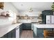 Stylish kitchen boasts two-tone cabinets, open shelving, and stainless steel appliances at 6464 Whitley Ln, Indianapolis, IN 46260