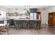 Modern kitchen with an island, bar stools and open shelves at 6464 Whitley Ln, Indianapolis, IN 46260