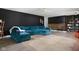 Stylish living room with a large blue sectional and modern decor at 6464 Whitley Ln, Indianapolis, IN 46260