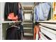 Custom walk-in closet with wood shelving and ample storage for clothing, shoes, and accessories at 6464 Whitley Ln, Indianapolis, IN 46260