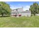 Backyard with a pergola, outdoor furniture, and mature trees at 6601 Valley Forge Ct, Indianapolis, IN 46237