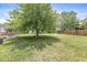 Large backyard with a shed, fence, and a patio at 6601 Valley Forge Ct, Indianapolis, IN 46237