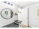 Bright bathroom with a round mirror, a desk, and a window at 6601 Valley Forge Ct, Indianapolis, IN 46237