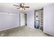 Cozy bedroom with a ceiling fan, and convenient closet shelving at 6601 Valley Forge Ct, Indianapolis, IN 46237