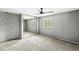 Spacious bedroom with a large closet, neutral colors, and a ceiling fan at 6601 Valley Forge Ct, Indianapolis, IN 46237