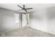 Neutral bedroom with a ceiling fan and a well-lit interior at 6601 Valley Forge Ct, Indianapolis, IN 46237