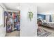 Bedroom with closet filled with clothes, a desk, and a patterned wall at 6601 Valley Forge Ct, Indianapolis, IN 46237