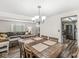 Open-concept dining area with connections to a living room and a modern kitchen at 6601 Valley Forge Ct, Indianapolis, IN 46237