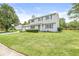Well-maintained two-story home with a manicured lawn, two-car garage, and lovely blue shutters at 6601 Valley Forge Ct, Indianapolis, IN 46237