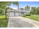 Traditional two-story home features a two-car garage, a basketball hoop, and a well-maintained lawn at 6601 Valley Forge Ct, Indianapolis, IN 46237