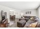 Open-concept living and dining areas featuring a large sectional sofa and stylish decor at 6601 Valley Forge Ct, Indianapolis, IN 46237