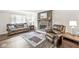 Comfortable living room featuring a brick fireplace, wooden flooring, and modern furniture at 6601 Valley Forge Ct, Indianapolis, IN 46237