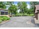 Backyard features a detached garage, home with porch and driveway into the yard at 6644 Mcfarland Rd, Indianapolis, IN 46227