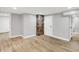Finished basement with hardwood floors and updated features, including exposed brick at 6644 Mcfarland Rd, Indianapolis, IN 46227