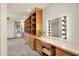 Spacious bedroom with custom built-ins and a makeup vanity with lighted mirror at 6644 Mcfarland Rd, Indianapolis, IN 46227