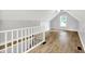 Finished attic bonus room with hardwood floors and a window for lots of natural light at 6644 Mcfarland Rd, Indianapolis, IN 46227