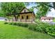 Beautiful home with a welcoming front porch, complemented by well-maintained landscaping at 6644 Mcfarland Rd, Indianapolis, IN 46227