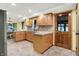 Bright kitchen featuring wood cabinets, light countertops, and eat in dining area at 6644 Mcfarland Rd, Indianapolis, IN 46227