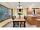Cozy dining area near the kitchen with bright natural light and a view of backyard at 6644 Mcfarland Rd, Indianapolis, IN 46227