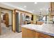 Modern kitchen with stainless steel appliances, light wood cabinets, and stylish countertops at 6644 Mcfarland Rd, Indianapolis, IN 46227