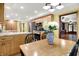 Charming kitchen and dining area featuring wood cabinets and a dining table with chairs at 6644 Mcfarland Rd, Indianapolis, IN 46227
