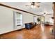 Open living room with hardwood floors and a comfortable seating area at 6644 Mcfarland Rd, Indianapolis, IN 46227