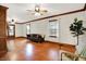 Bright and airy living room with hardwood floors, ceiling fans, and ample natural light at 6644 Mcfarland Rd, Indianapolis, IN 46227