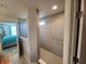 Bathroom view featuring a glass-enclosed shower and glimpses into the bedroom at 6731 Keepsake Dr, Whitestown, IN 46075
