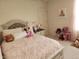 Charming bedroom features a cozy bed with decorative pillows and plush bedding at 6731 Keepsake Dr, Whitestown, IN 46075