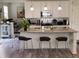 Bright kitchen featuring a large island with granite countertops and seating for three at 6731 Keepsake Dr, Whitestown, IN 46075