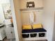Entryway featuring a built-in bench with storage and decorative pillows at 6731 Keepsake Dr, Whitestown, IN 46075