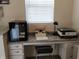 Home office space featuring a desk with drawers, a printer, and a mini fridge at 6731 Keepsake Dr, Whitestown, IN 46075