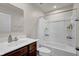 A full bathroom with a vanity, mirror, toilet, and a bathtub shower combination at 7171 E Rising Sun S Cir, Camby, IN 46113