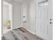 Welcoming entryway featuring laminate flooring and a view into adjacent rooms at 7171 E Rising Sun S Cir, Camby, IN 46113