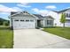 Charming single-Gathering home boasts a well-maintained lawn, a two-car garage, and classic architectural details at 7171 E Rising Sun S Cir, Camby, IN 46113