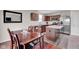 Well-equipped kitchen boasts an island, modern appliances, and a dining area with ample natural light at 7171 E Rising Sun S Cir, Camby, IN 46113