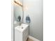 This bathroom features a sink, mirror and towel rack at 721 E North St # 2C, Indianapolis, IN 46202