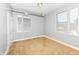This bedroom features neutral walls and carpet, and it also has two windows letting in natural light at 721 E North St # 2C, Indianapolis, IN 46202