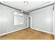 This bedroom features neutral walls and carpet, and it also has a window letting in natural light at 721 E North St # 2C, Indianapolis, IN 46202