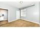 This bedroom features neutral walls and carpet, and it also has a window and a bathroom at 721 E North St # 2C, Indianapolis, IN 46202
