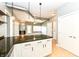 View from kitchen island, looking towards the living room and wet bar at 721 E North St # 2C, Indianapolis, IN 46202