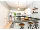 Modern kitchen with granite countertops, stainless steel appliances, and a breakfast bar at 721 E North St # 2C, Indianapolis, IN 46202