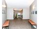 An interior shot of the lobby with benches and access to the elevator at 721 E North St # 2C, Indianapolis, IN 46202