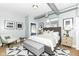 Comfortable main bedroom with neutral tones, stylish decor, and plenty of natural light at 721 E North St # 2C, Indianapolis, IN 46202
