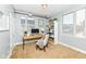 Bright office space with a functional desk setup and a cozy reading nook at 721 E North St # 2C, Indianapolis, IN 46202
