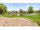 An expansive backyard featuring a beautifully patterned patio and picturesque water views at 725 Ridge Gate Dr, Brownsburg, IN 46112