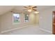 Bedroom featuring plush carpet, neutral walls, two large windows, and a ceiling fan at 725 Ridge Gate Dr, Brownsburg, IN 46112