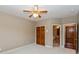 Bedroom features wood-look doors, neutral paint, carpet, and an ensuite bath with ceramic tile flooring at 725 Ridge Gate Dr, Brownsburg, IN 46112