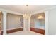 Dining room with detailed ceiling, columns, and a chandelier at 725 Ridge Gate Dr, Brownsburg, IN 46112